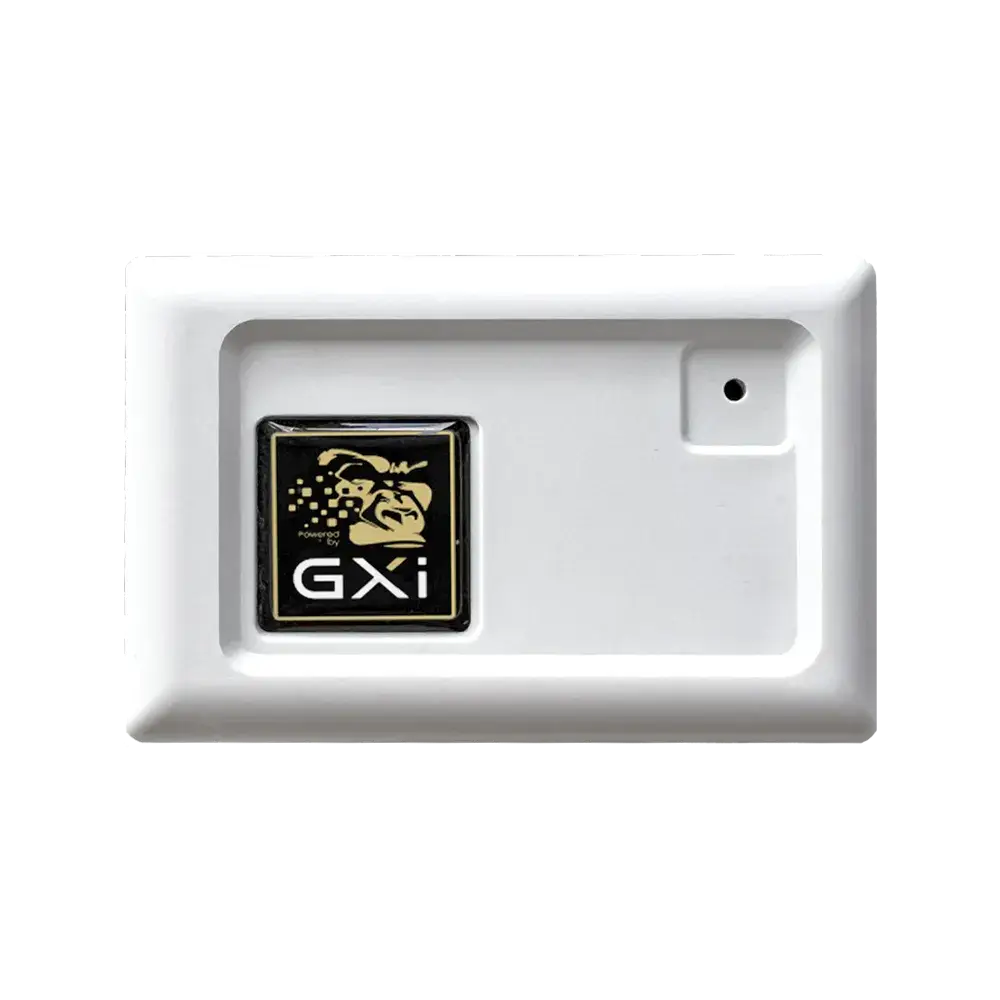 A digital temperature and humidity monitor displaying optimal readings inside a grow tent with healthy plants in the background.