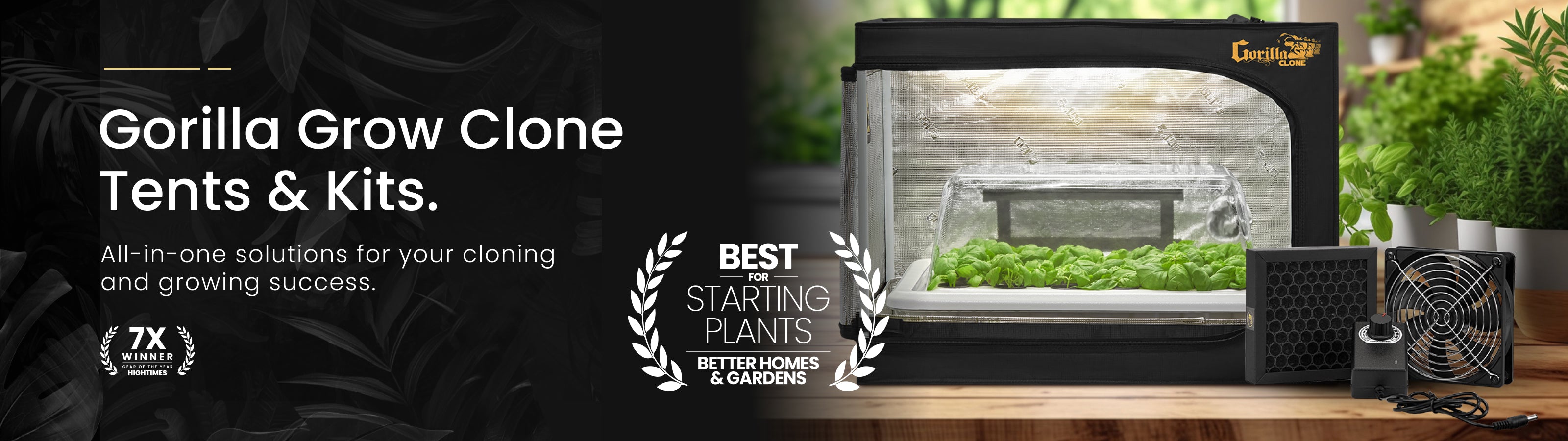 Gorilla Grow Clone Tents & Kits with a black tent on a wooden surface, surrounded by plants.